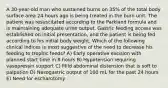 A 30-year-old man who sustained burns on 35% of the total body surface area 24 hours ago is being treated in the burn unit. The patient was resuscitated according to the Parkland formula and is maintaining adequate urine output. Gastric feeding access was established on initial presentation, and the patient is being fed according to his initial body weight. Which of the following clinical indices is most suggestive of the need to decrease his feeding to trophic feeds? A) Early operative excision with planned start time in 8 hours B) Hypotension requiring vasopressin support C) Mild abdominal distension that is soft to palpation D) Nasogastric output of 100 mL for the past 24 hours E) Need for escharotomy