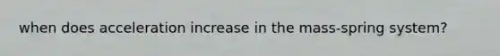 when does acceleration increase in the mass-spring system?