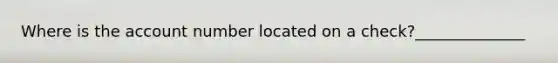 Where is the account number located on a check?______________