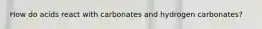 How do acids react with carbonates and hydrogen carbonates?