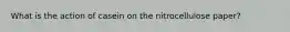What is the action of casein on the nitrocellulose paper?