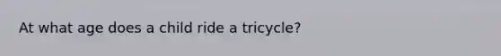 At what age does a child ride a tricycle?