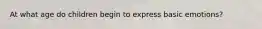 At what age do children begin to express basic emotions?
