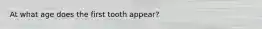 At what age does the first tooth appear?
