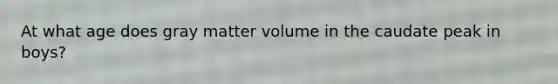 At what age does gray matter volume in the caudate peak in boys?