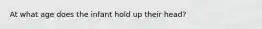 At what age does the infant hold up their head?