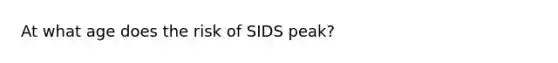 At what age does the risk of SIDS peak?