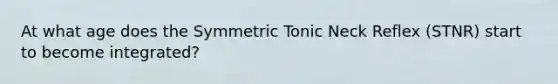 At what age does the Symmetric Tonic Neck Reflex (STNR) start to become integrated?