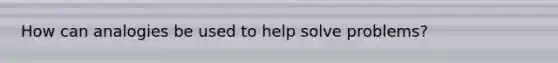 How can analogies be used to help solve problems?