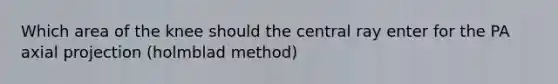 Which area of the knee should the central ray enter for the PA axial projection (holmblad method)