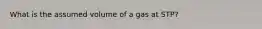 What is the assumed volume of a gas at STP?