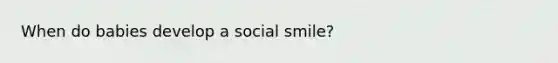 When do babies develop a social smile?