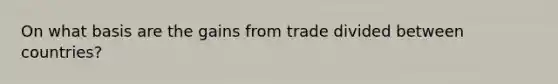 On what basis are the gains from trade divided between countries?