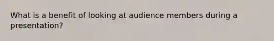 What is a benefit of looking at audience members during a presentation?