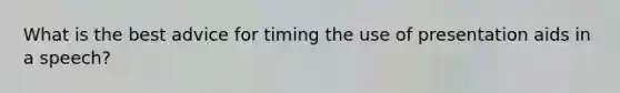 What is the best advice for timing the use of presentation aids in a speech?