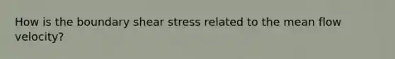 How is the boundary shear stress related to the mean flow velocity?