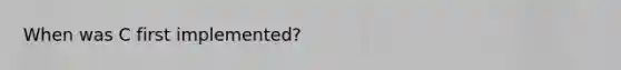 When was C first implemented?