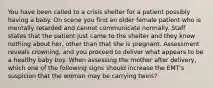 You have been called to a crisis shelter for a patient possibly having a baby. On scene you find an older female patient who is mentally retarded and cannot communicate normally. Staff states that the patient just came to the shelter and they know nothing about​ her, other than that she is pregnant. Assessment reveals​ crowning, and you proceed to deliver what appears to be a healthy baby boy. When assessing the mother after​ delivery, which one of the following signs should increase the​ EMT's suspicion that the woman may be carrying​ twins?