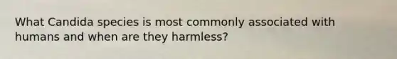 What Candida species is most commonly associated with humans and when are they harmless?