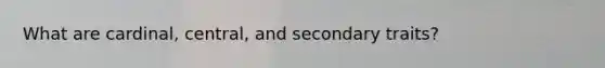 What are cardinal, central, and secondary traits?