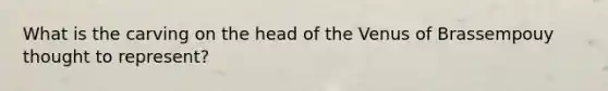What is the carving on the head of the Venus of Brassempouy thought to represent?