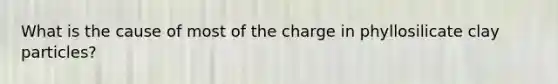 What is the cause of most of the charge in phyllosilicate clay particles?