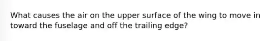 What causes the air on the upper surface of the wing to move in toward the fuselage and off the trailing edge?