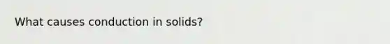 What causes conduction in solids?