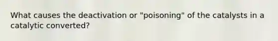 What causes the deactivation or "poisoning" of the catalysts in a catalytic converted?