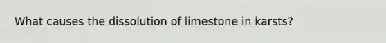 What causes the dissolution of limestone in karsts?