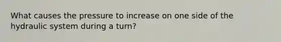 What causes the pressure to increase on one side of the hydraulic system during a turn?