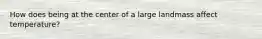 How does being at the center of a large landmass affect temperature?