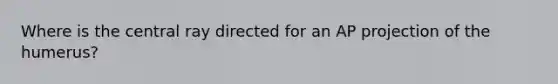 Where is the central ray directed for an AP projection of the humerus?