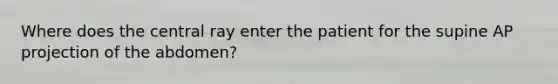 Where does the central ray enter the patient for the supine AP projection of the abdomen?