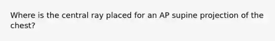 Where is the central ray placed for an AP supine projection of the chest?