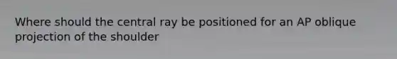 Where should the central ray be positioned for an AP oblique projection of the shoulder