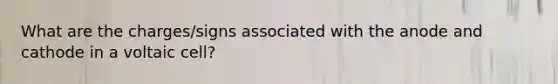 What are the charges/signs associated with the anode and cathode in a voltaic cell?