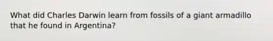 What did Charles Darwin learn from fossils of a giant armadillo that he found in Argentina?