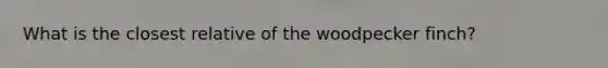 What is the closest relative of the woodpecker finch?