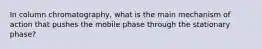 In column chromatography, what is the main mechanism of action that pushes the mobile phase through the stationary phase?