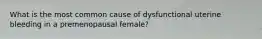 What is the most common cause of dysfunctional uterine bleeding in a premenopausal female?