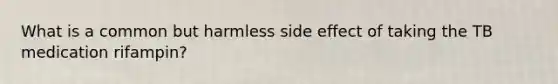 What is a common but harmless side effect of taking the TB medication rifampin?