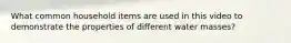 What common household items are used in this video to demonstrate the properties of different water masses?