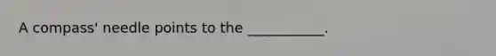 A compass' needle points to the ___________.