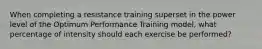 When completing a resistance training superset in the power level of the Optimum Performance Training model, what percentage of intensity should each exercise be performed?