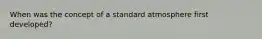 When was the concept of a standard atmosphere first developed?