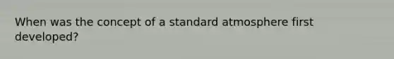 When was the concept of a standard atmosphere first developed?