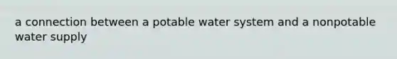 a connection between a potable water system and a nonpotable water supply