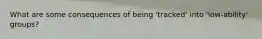 What are some consequences of being 'tracked' into 'low-ability' groups?