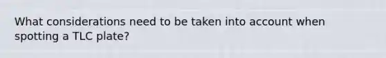 What considerations need to be taken into account when spotting a TLC plate?